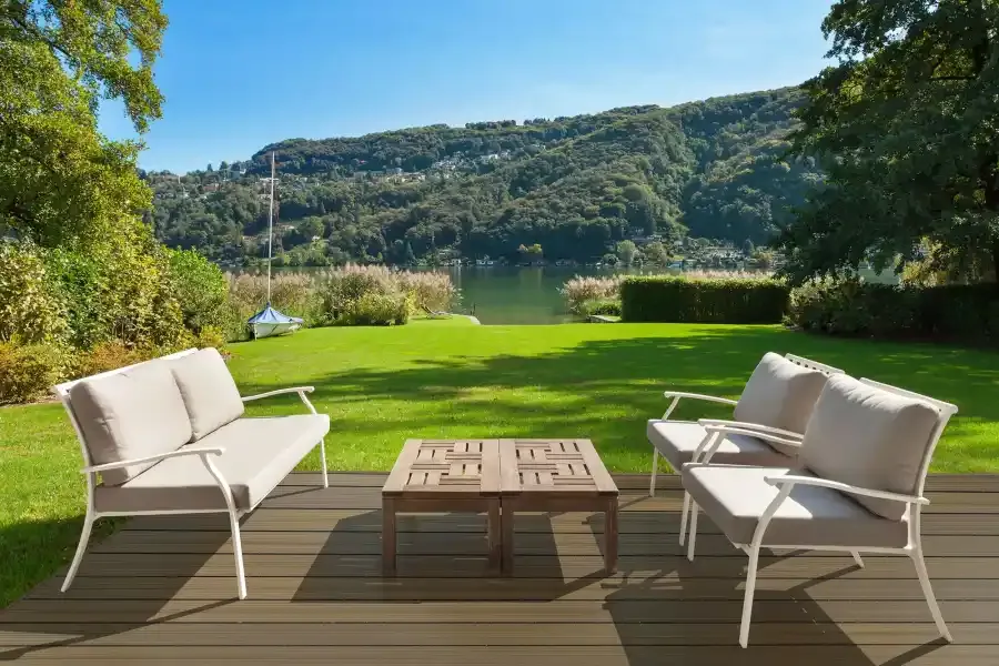 CLASSIC amber tan garden deck by a pond (manufacturer photo)