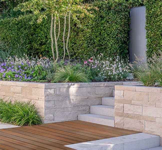 Garden steps and deck with a stone wall (manufacturer photo)